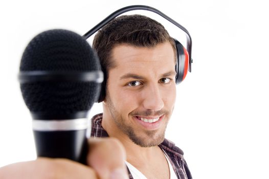 smiling male holding microphone on an isolated white background