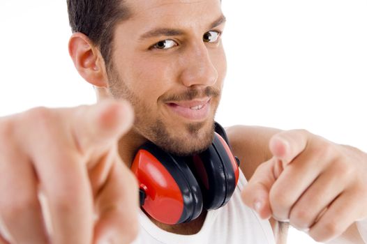 man pointing at camera with both hands against white background