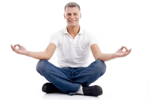 smiling model in yoga posture with white background