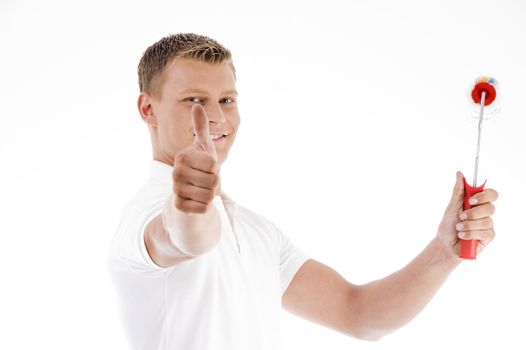 handsome painter showing thumbs up on an isolated background