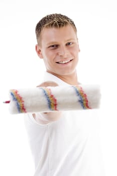 smiling male showing roller brush on an isolated white background