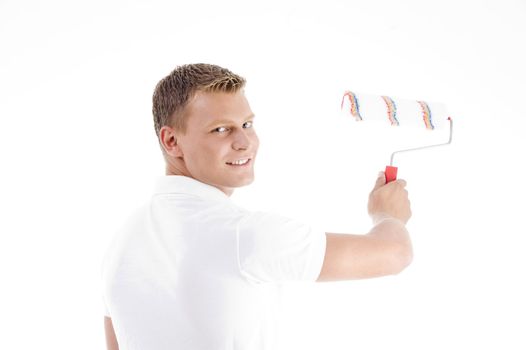 male painting with roller brush on an isolated background