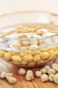 Dry raw chickpeas soaking in water before cooking