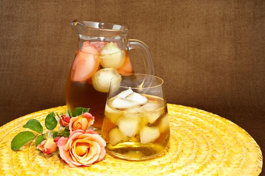 Drink with ice on colored background and contrasting
