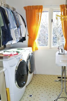 Laundry room with modern washer and dryer