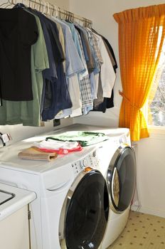 Laundry room with modern washer and dryer