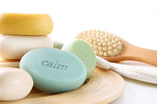 Assortment of colored scented soaps on white