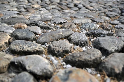 Closeup of a very old walkway made of found stones