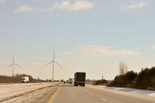 Indiana Wind Turbines loom over the highway