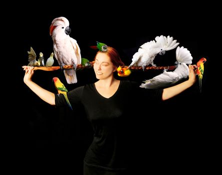 Woman Who Has Multiple Exotic Birds in Her Very Long Red Hair