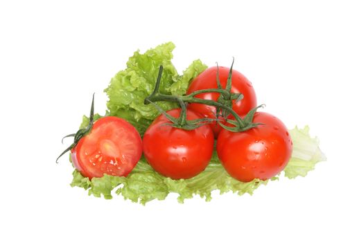 Few fresh tomatoes lying on green lettuce leaf. Isolated on white background with clipping path
