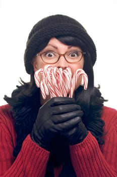 Attractive Woman Holds Candy Canes Isolated on a White Background.