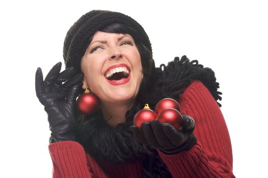 Attractive Woman Holding Red Ornaments Isolated on a White Background.