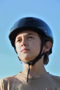 Portrait of a boy wearing a skateboard helmet
