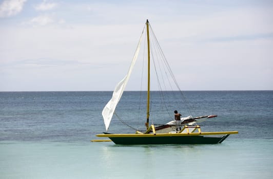 Lonely boat at ocean. Philippines. Island Boracay