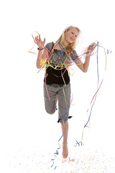 Young blond teenager jumping for joy on her birthday