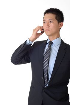 Portrait of confident young businessman talking on cellphone with copyspace.