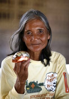 Philippines. Island Boracay. October, 2008. Portrait of the old woman of Asia selling souvenirs. 