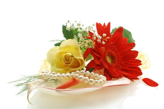 collection of flowers with a perls on white background