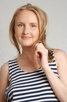 pretty blond in sailor's striped vest