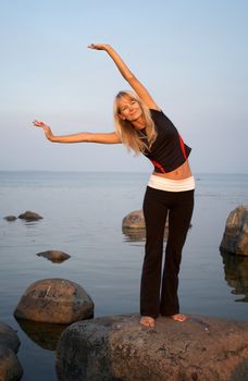 fit girl working out at the seashore