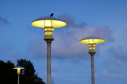 The moderm street lamps over blue sky