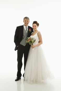 Portrait of Caucasian groom and Asian bride.