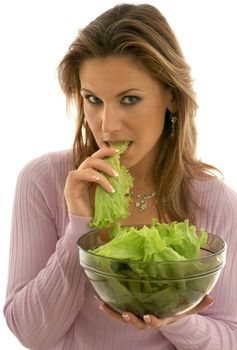 pretty woman eating lettuce