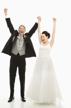 Portrait of Caucasian groom and Asian bride cheering.