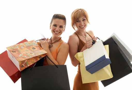 two happy girls with shopping bags