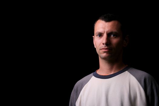 young man over black background