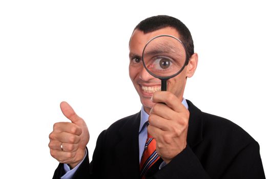 business man with a loupe over white background