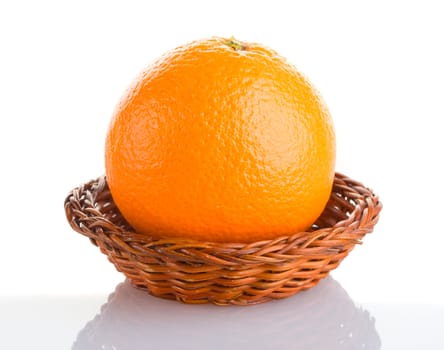 close-up orange in basket with reflection, isolated on white