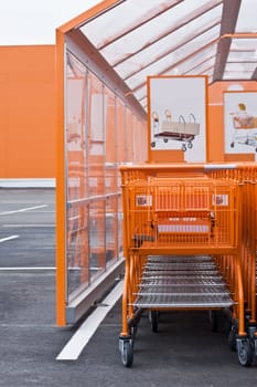 Orange Shopping Cart parking near big mart