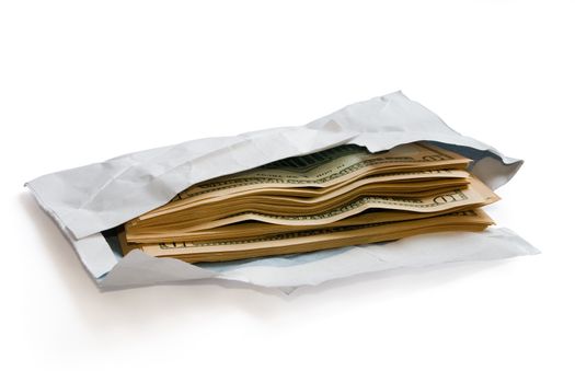 Stack of dolars in open envelope isolated on white. Clipping path included. Concept of coruption, illegal proffit, racketeering.