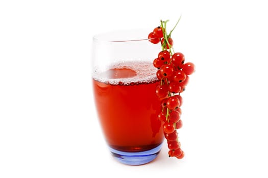 Glass cup with red currant juice isolated on white