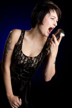 Female singer singing into microphone