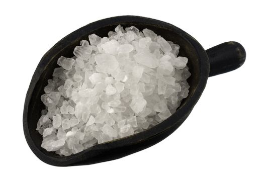 white coarse crystal of rock salt on a vintage wooden scoop, isolated