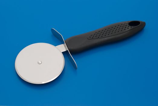 Pizza knife isolated on the blue background