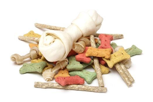 An isolated group of various dog treats.