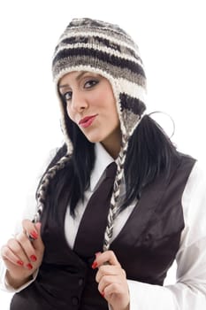 young female wearing woolen cap against white background