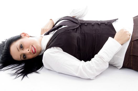 young woman lying down on floor against white background