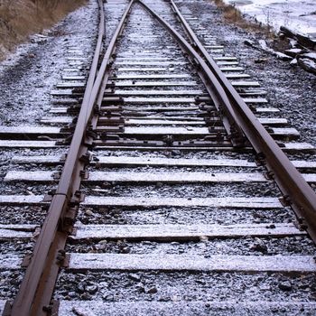 First snow of the year melting on contact on train tracks