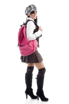 young student with school bag against white background