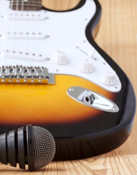 Microphone near the body of an electric guitar, shallow depth of field