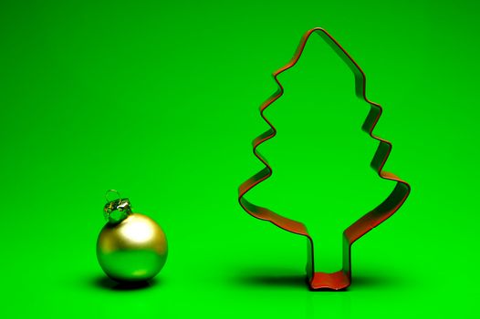 A cookie cutter christmas tree isolated against a green background