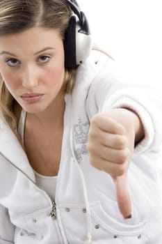 young woman showing thumbs down with white background