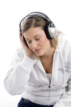woman listening to music with closed eyes on an isolated white background