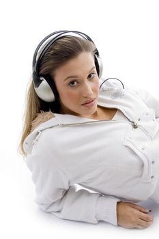 young woman enjoying music with headphones on an isolated white background
