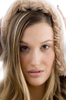 young model posing in winter clothes on an isolated white background